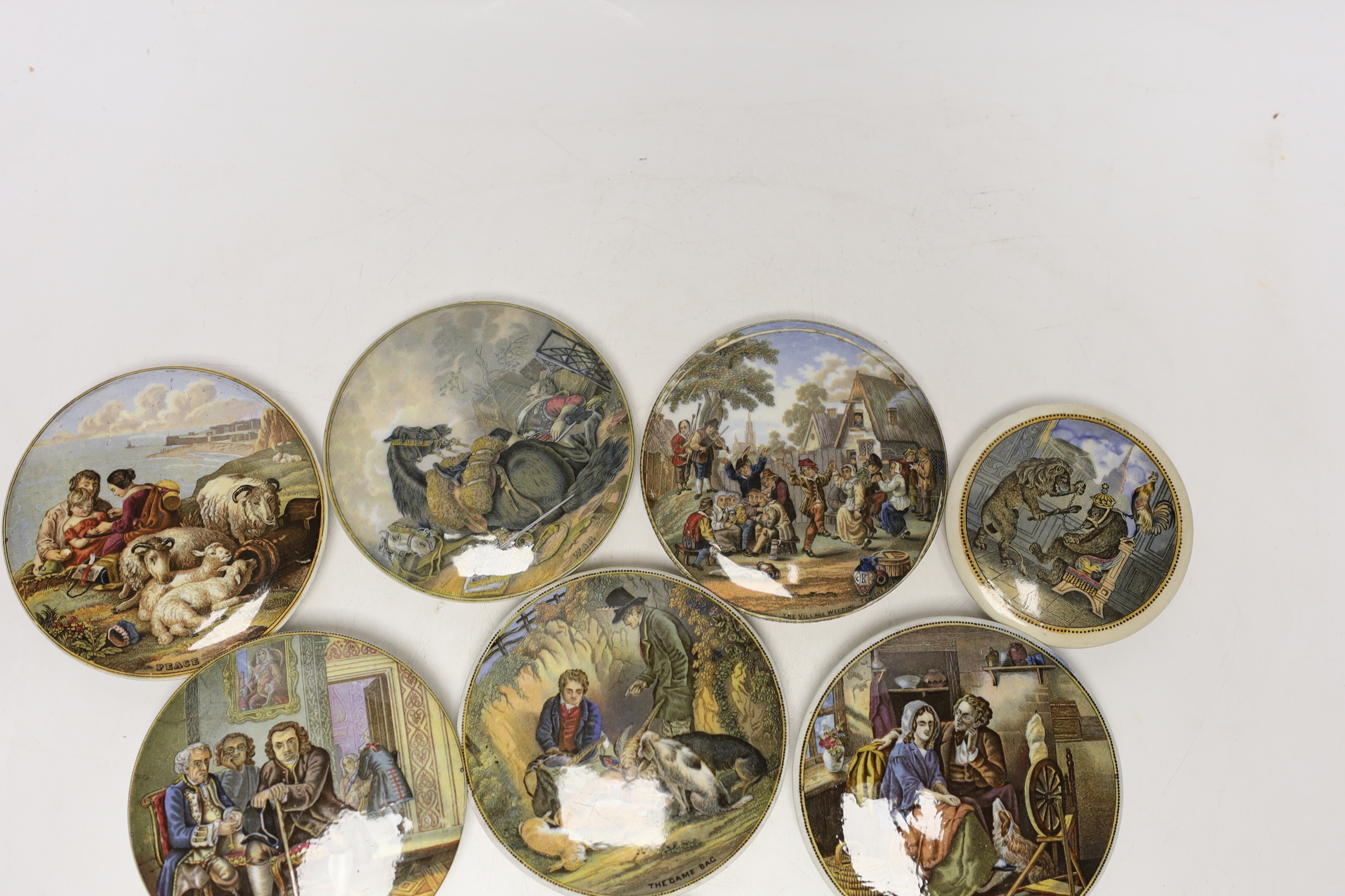 Eight Victorian ceramic Prattware pot lids